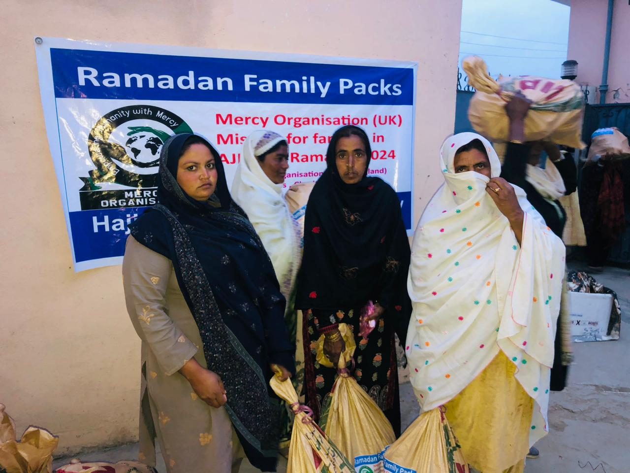 Women collecting Ramadan family packs in Azad Kashmir
