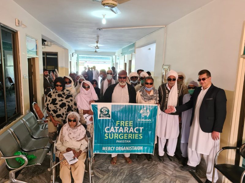 Patients and the Mercy Organisation team at a cataract surgery camp